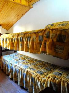 Katil atau katil-katil dalam bilik di Apartament L'àtic