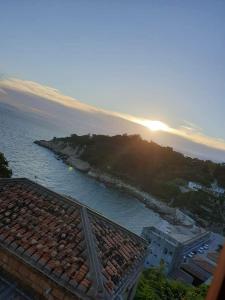 a view of the ocean from a building with the sunset at East Mountain Light Brigade in Nangan