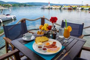 a table with a plate of breakfast food on it at Guesthouse Machi in Kato Gatzea