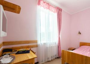Postel nebo postele na pokoji v ubytování Тиса Економ