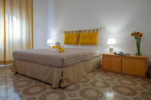 Postel nebo postele na pokoji v ubytování Hotel Soleo