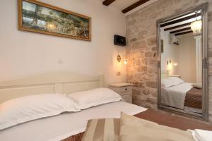 Postel nebo postele na pokoji v ubytování Villa Carrara
