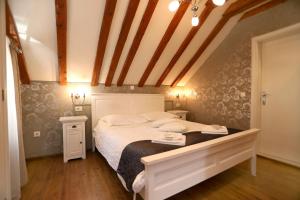 Postel nebo postele na pokoji v ubytování Villa Carrara