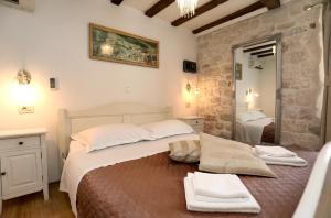 Postel nebo postele na pokoji v ubytování Villa Carrara