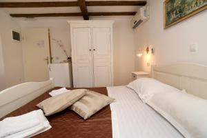 Postel nebo postele na pokoji v ubytování Villa Carrara