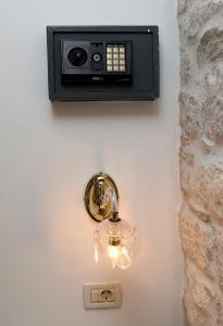 a lightswitch on a wall with a clock on it at Villa Carrara in Trogir