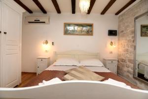Postel nebo postele na pokoji v ubytování Villa Carrara