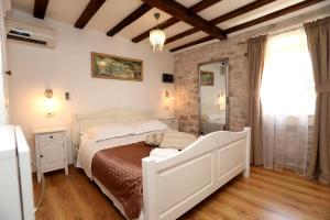 Postel nebo postele na pokoji v ubytování Villa Carrara
