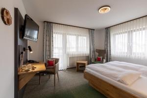 Кровать или кровати в номере Landhotel Traube