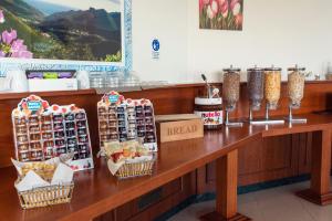 a counter in a store with food on it at Hotel - Motel Flower in Gropello Cairoli