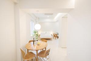 a dining room with a table and chairs at White Linen House in Seoul