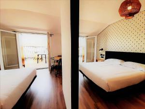 Posteľ alebo postele v izbe v ubytovaní Hotel Matilde by gaiarooms