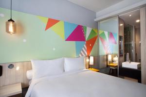 Voodi või voodid majutusasutuse Ibis Styles Jakarta Sunter toas