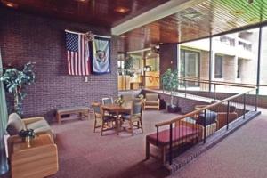 a restaurant with a table and chairs and a flag at Hawks Nest Lodge in Ansted