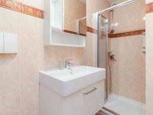 a bathroom with a sink and a shower at Apartment Antonella & Napoletano-3 by Interhome in Umag