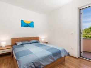 Postel nebo postele na pokoji v ubytování Apartment Glavotok by Interhome