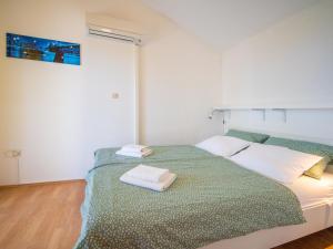 Ένα ή περισσότερα κρεβάτια σε δωμάτιο στο Holiday Home Graziani by Interhome