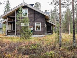 an old house in the middle of a field at Holiday Home Sallanrinne b by Interhome in Salla