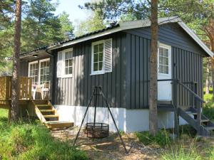 a tiny house in the woods at Chalet Sandrabu - SOW056 by Interhome in Øyuvstad