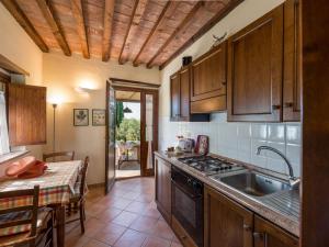 a kitchen with a sink and a stove top oven at Apartment Edera by Interhome in Campagnatico