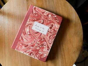 a book sitting on top of a wooden table at Apartment Ermitage 11 by Interhome in Villars-sur-Ollon +27 photos