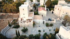 an aerial view of a house with a yard at Fameliti Casa Torre - Historic Maniot Tower House in Stavríon
