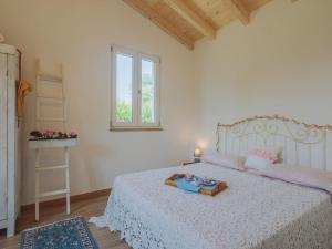 A bed or beds in a room at Holiday Home Casina del Sole by Interhome