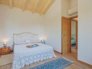 A bed or beds in a room at Holiday Home Casina del Sole by Interhome