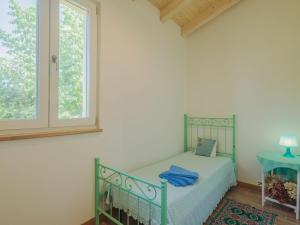 A bed or beds in a room at Holiday Home Casina del Sole by Interhome