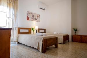 Postel nebo postele na pokoji v ubytování Hotel Soleo