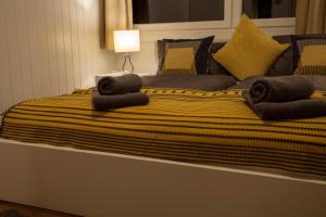 a large bed with two pillows on top of it at Apart Ritzkogel Willingen in Willingen