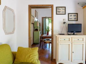 A television and/or entertainment centre at Holiday Home Calvello by Interhome