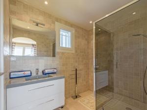 a bathroom with a sink and a shower at Villa Clos des collines by Interhome in Gassin