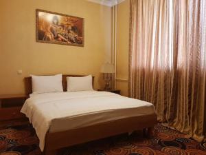 
Кровать или кровати в номере Sunflow Park Hotel
