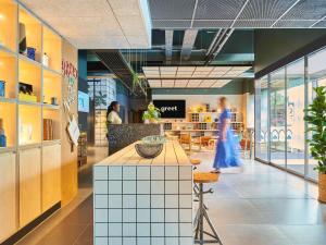 Coin salon dans l'établissement Greet Hotel Paris porte de la Chapelle - Aréna