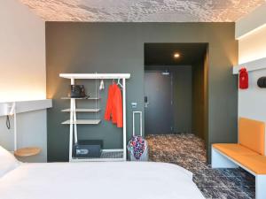 a bedroom with a bed and a closet at ibis Bucharest Politehnica in Bucharest