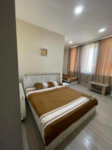 Voodi või voodid majutusasutuse Fazis Hotel toas