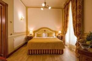 Voodi või voodid majutusasutuse Grand Hotel Wagner toas