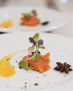 a white plate with a piece of food on it at Helios Benidorm in Benidorm