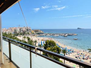 a balcony with a view of a beach and the ocean at Flats Friends Atlantida in Benidorm