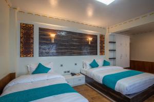 Tempat tidur dalam kamar di Hotel Himalayan Glacier