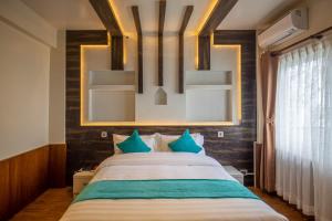 Tempat tidur dalam kamar di Hotel Himalayan Glacier
