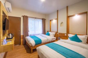 Tempat tidur dalam kamar di Hotel Himalayan Glacier