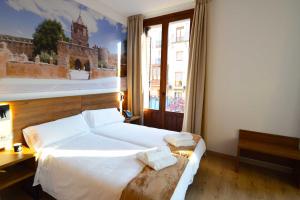 A bed or beds in a room at Encanto Tarazona