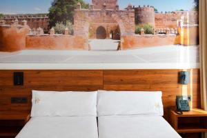 A bed or beds in a room at Encanto Tarazona