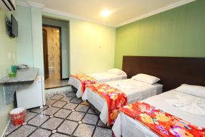 Postel nebo postele na pokoji v ubytování Hotel Lagoa