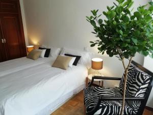 A bed or beds in a room at La Casa de Zamora