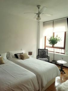 A bed or beds in a room at La Casa de Zamora