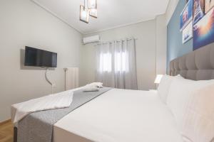 Ένα ή περισσότερα κρεβάτια σε δωμάτιο στο Stylish Suite by CloudKeys