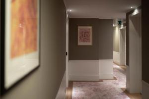 a hallway with a painting on the wall at Grand Hotel Portovenere in Portovenere